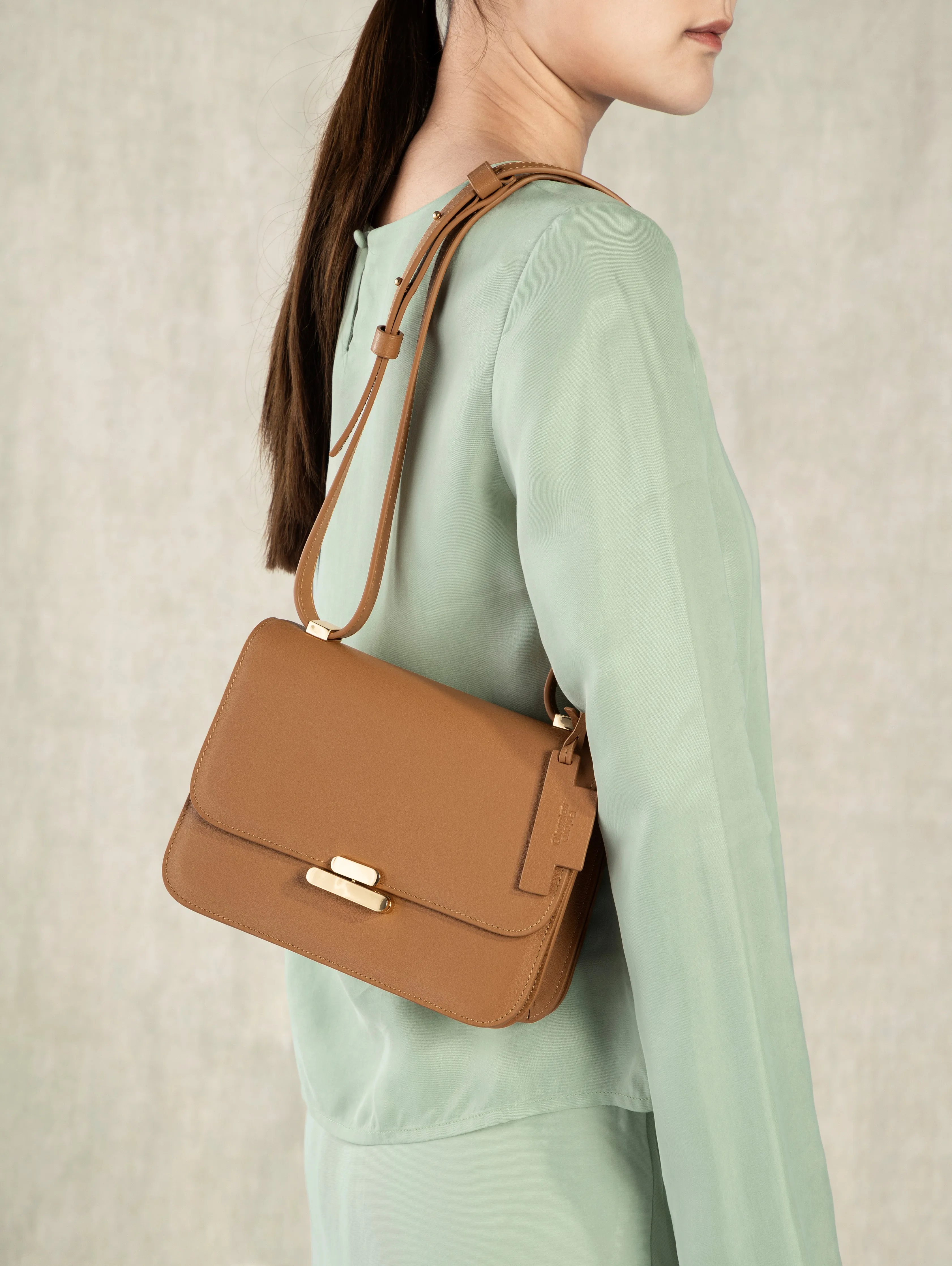 Future Classics   Small Flip Lock Crossbody Caramel